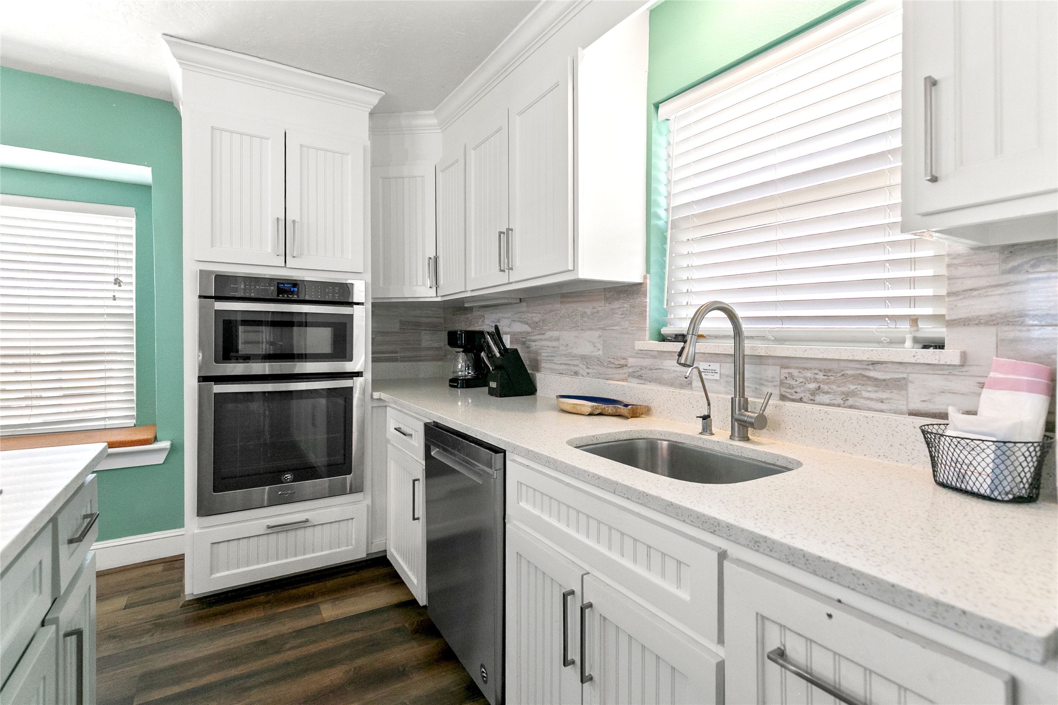 319 Pompano Lane Surfside Beach, TX 77541 - Photo 14 of 48 a kitchen with appliances a sink and cabinets