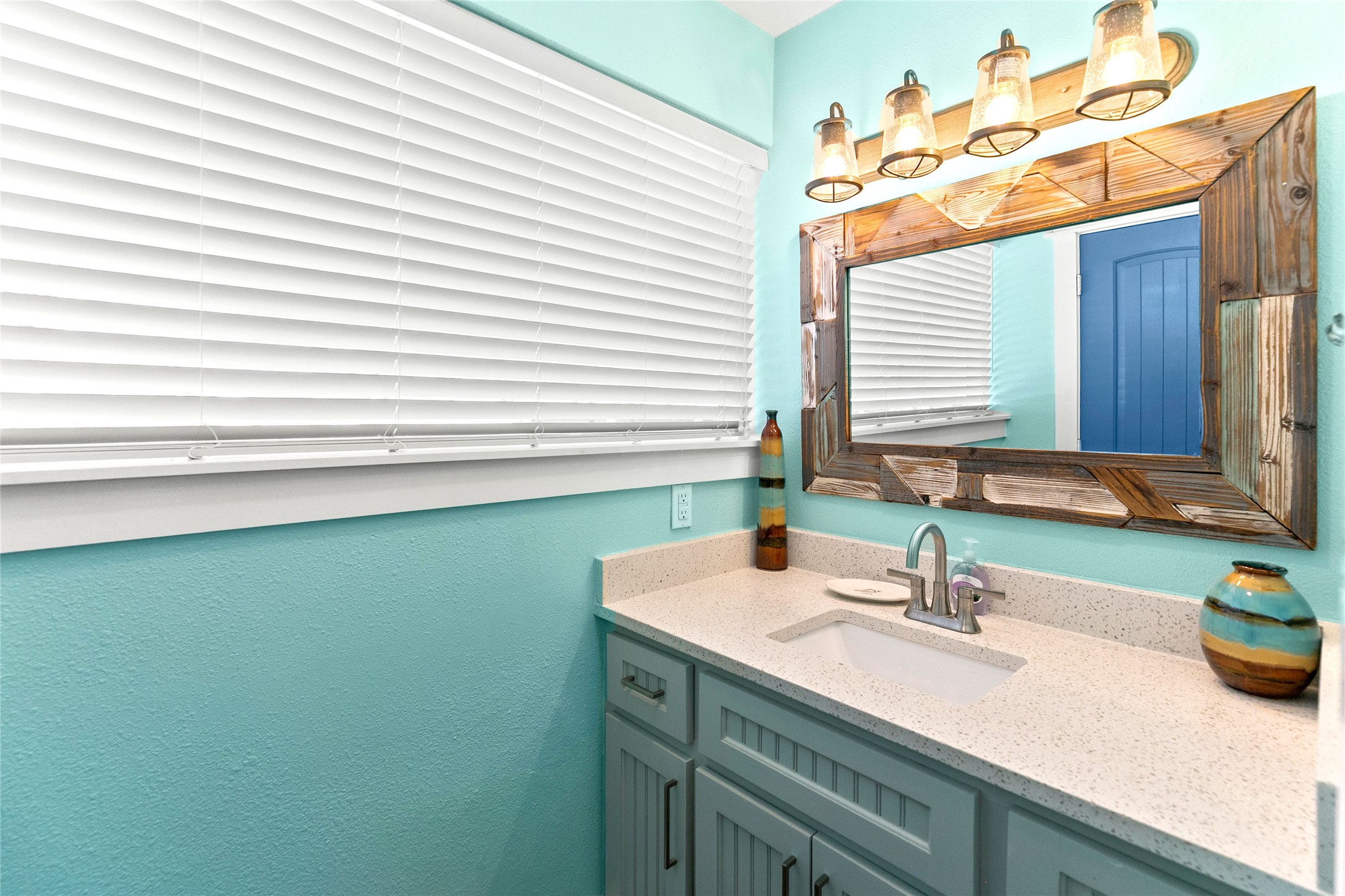 319 Pompano Lane Surfside Beach, TX 77541 - Photo 17 of 48 a bathroom with a sink and a mirror