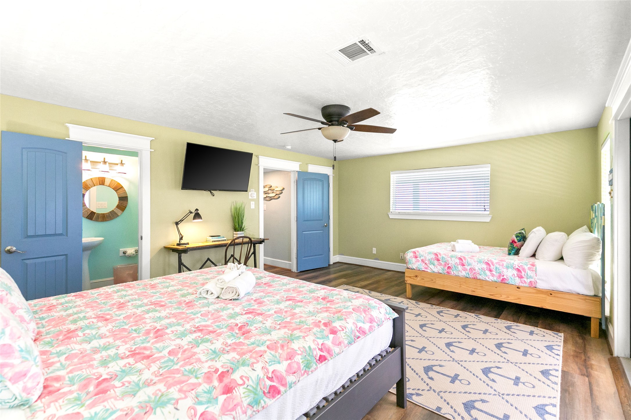 319 Pompano Lane Surfside Beach, TX 77541 - Photo 20 of 48 a bedroom with a bed and a flat tv screen on dresser