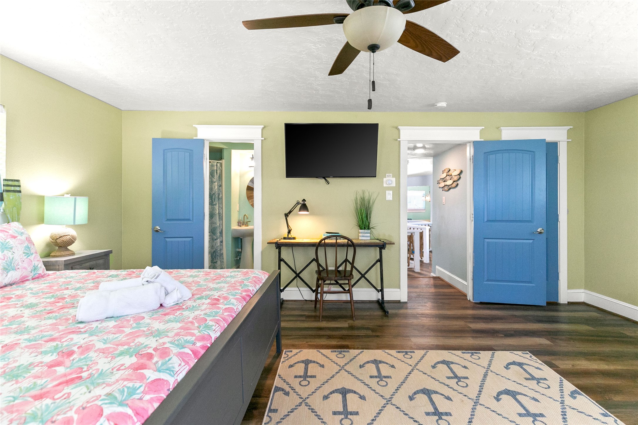 319 Pompano Lane Surfside Beach, TX 77541 - Photo 21 of 48 a bedroom with a bed and wooden floor