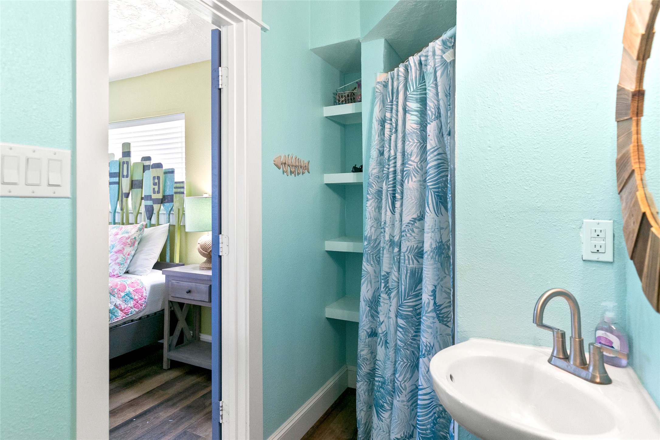 319 Pompano Lane Surfside Beach, TX 77541 - Photo 23 of 48 a bathroom with a sink and a mirror