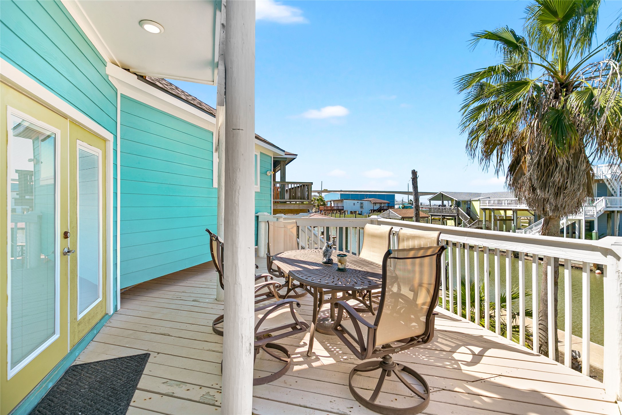 319 Pompano Lane Surfside Beach, TX 77541 - Photo 33 of 48 a view of a chairs and table in patio with a backyard
