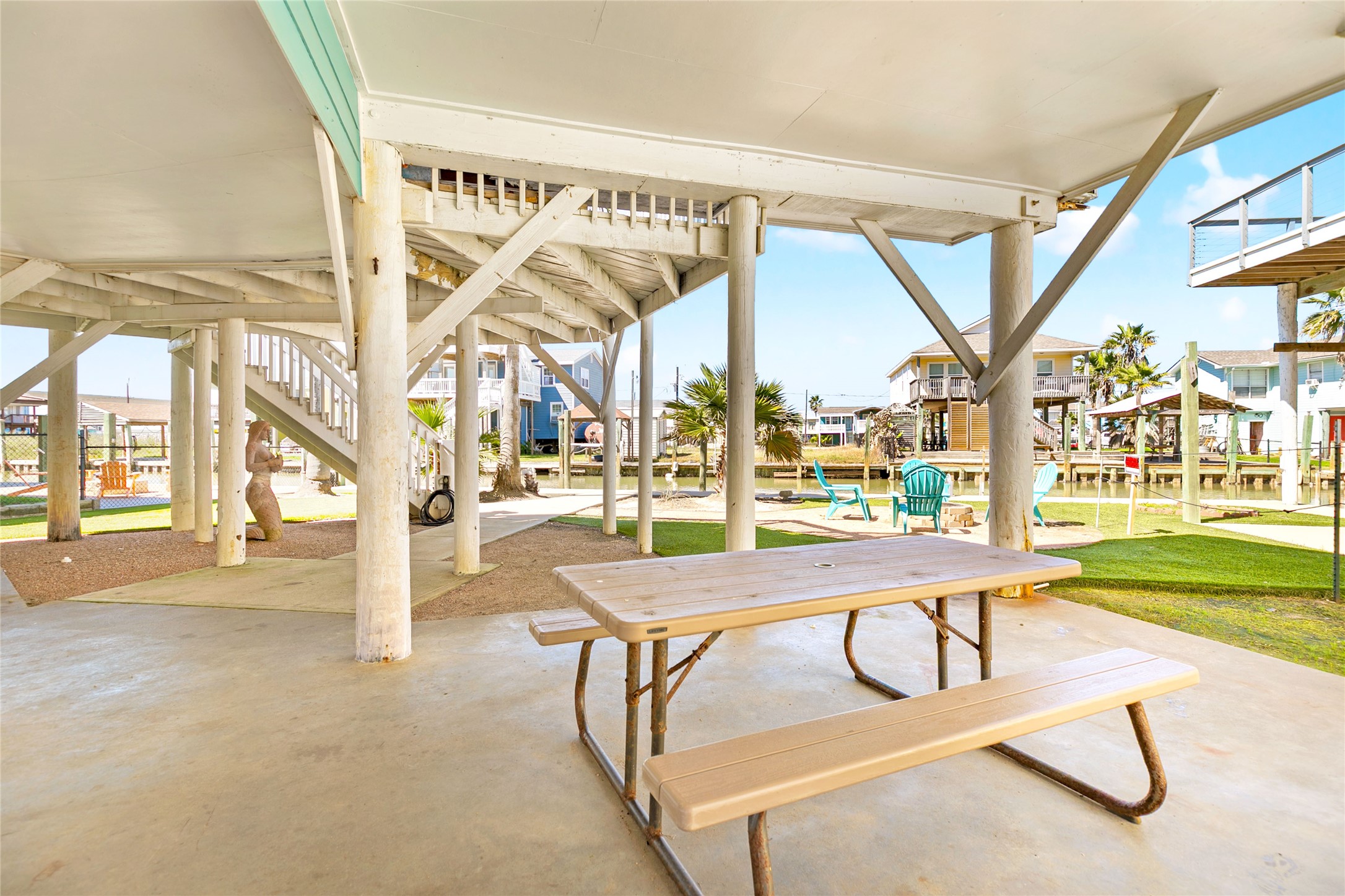 319 Pompano Lane Surfside Beach, TX 77541 - Photo 36 of 48 a view of a swimming pool with outdoor seating