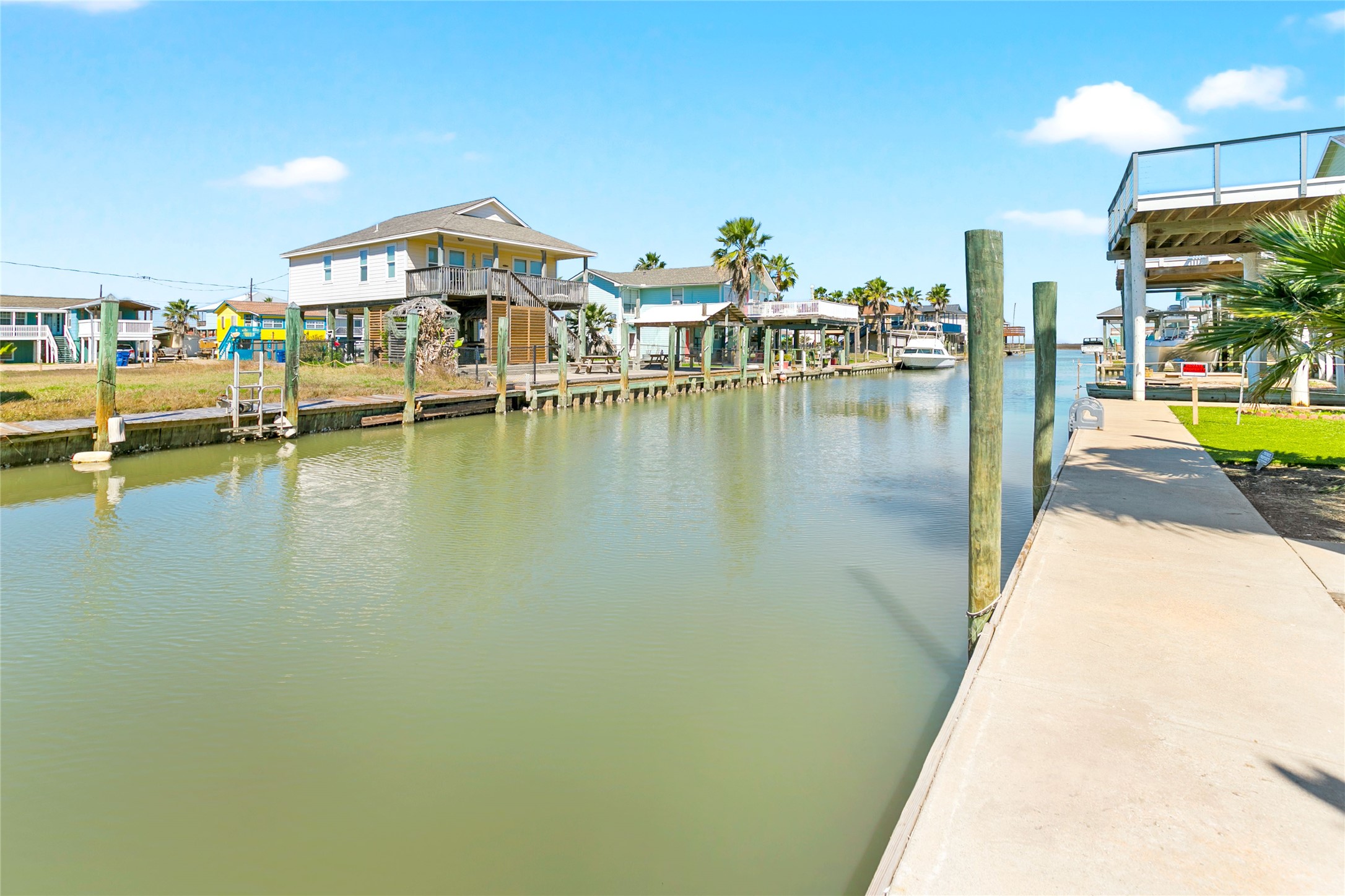 319 Pompano Lane Surfside Beach, TX 77541 - Photo 39 of 48 a view of a swimming pool with outdoor seating