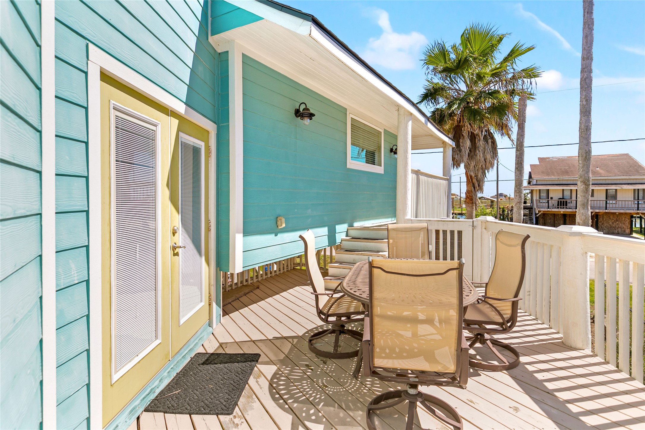 319 Pompano Lane Surfside Beach, TX 77541 - Photo 10 of 48 a view of a patio with table and chairs and a potted plant
