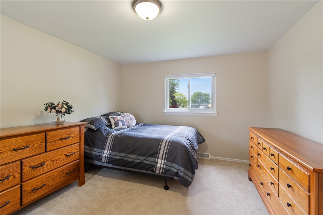 218 Kusak Road Henrietta, NY 14467 - Photo 15 of 33 Second bedroom has large space for queen bed and d