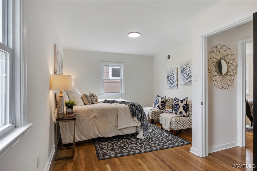 2601 Brook Road Richmond, VA 23220 - Photo 15 of 28 Bedroom with baseboards, visible vents, and wood f