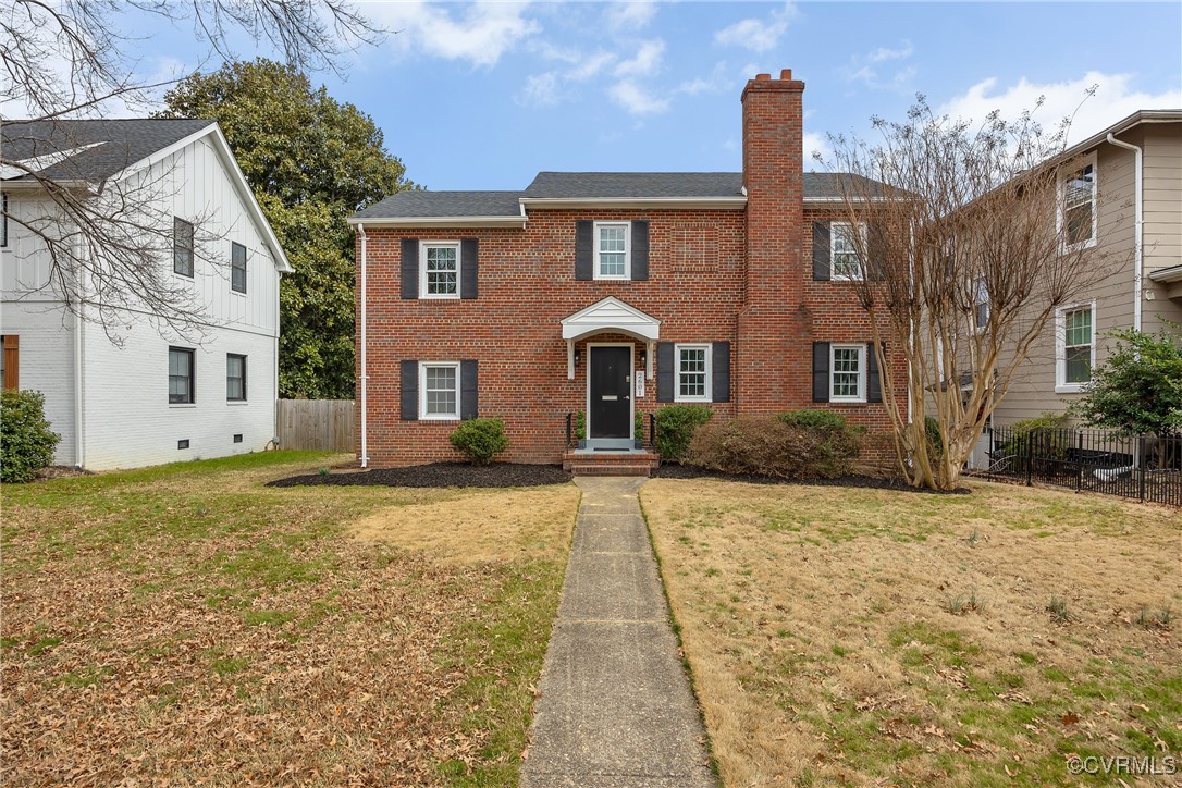 2601 Brook Road Richmond, VA 23220 - Photo 26 of 28 Colonial house with a front lawn, a chimney, fence