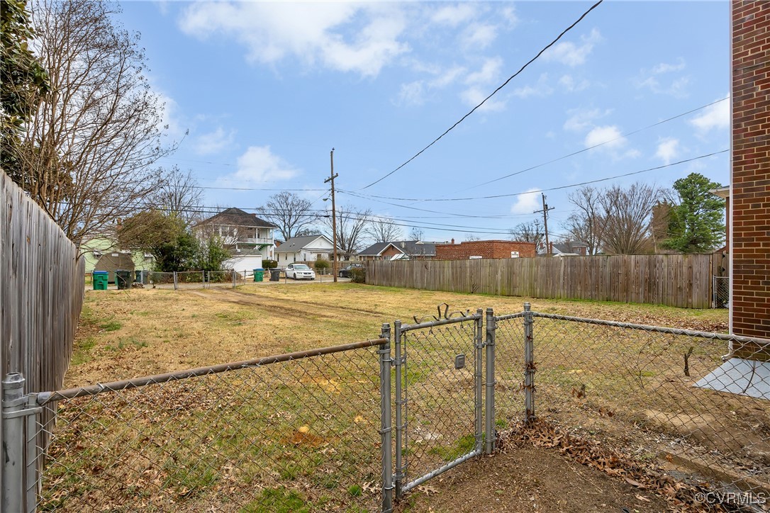 2601 Brook Road Richmond, VA 23220 - Photo 28 of 28 View of yard featuring a gate and fence