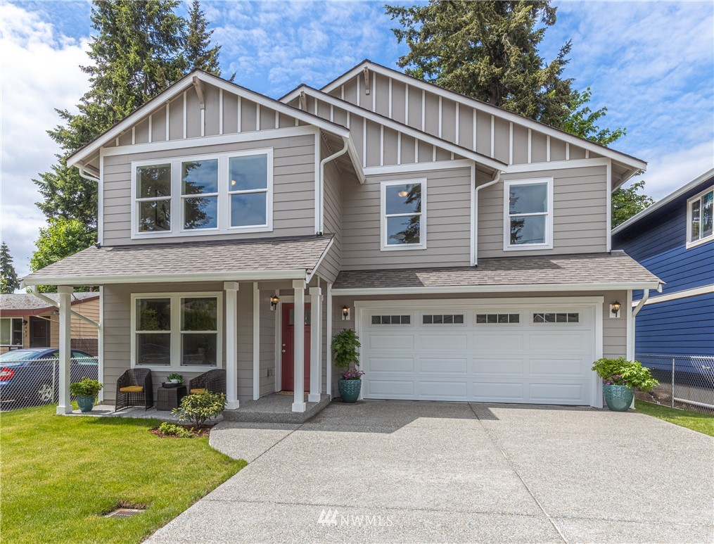 613 Index Avenue Northeast Renton, WA 98056 - Photo 1 of 32 a front view of a house with a yard and garage