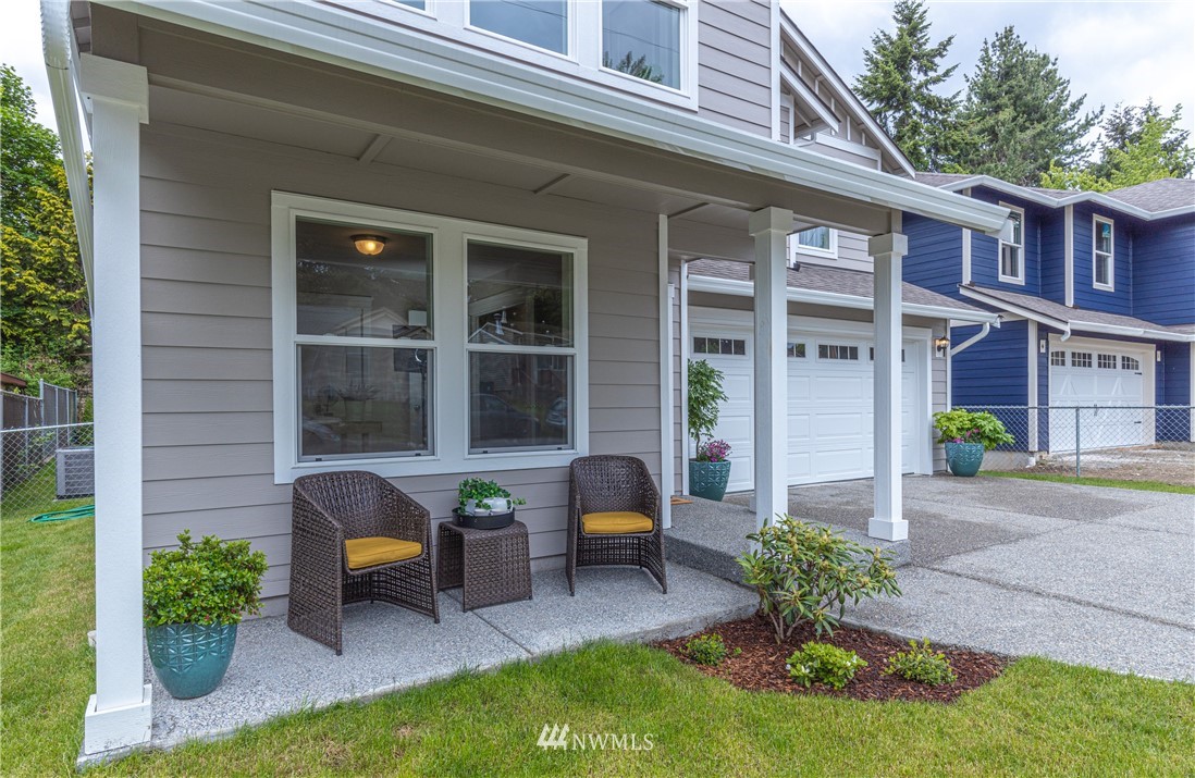613 Index Avenue Northeast Renton, WA 98056 - Photo 2 of 32 a house view with a seating space and garden