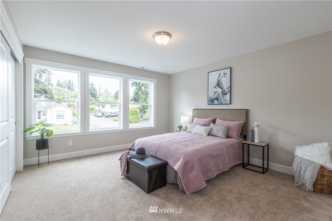 613 Index Avenue Northeast Renton, WA 98056 - Photo 17 of 32 a spacious bedroom with a bed and a window