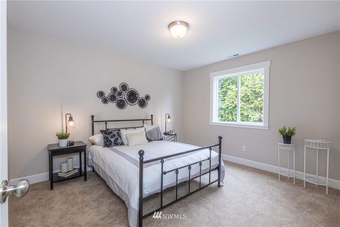 613 Index Avenue Northeast Renton, WA 98056 - Photo 20 of 32 a bedroom with a bed and a window