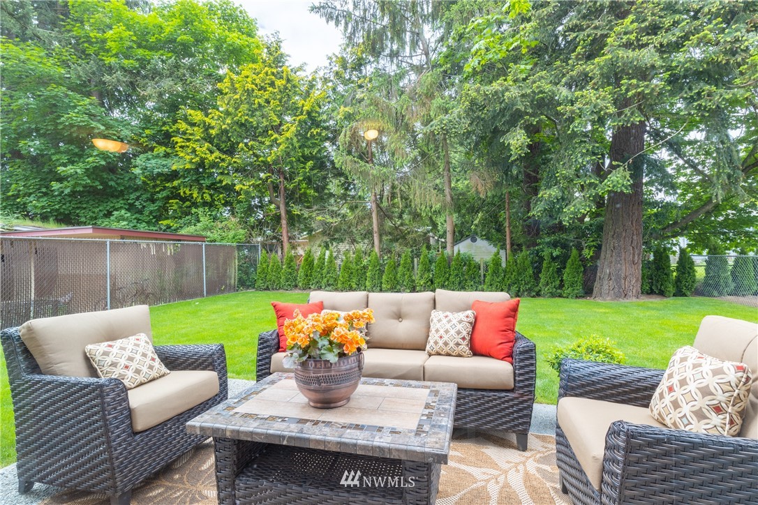 613 Index Avenue Northeast Renton, WA 98056 - Photo 3 of 32 a view of a patio with couches and a big yard