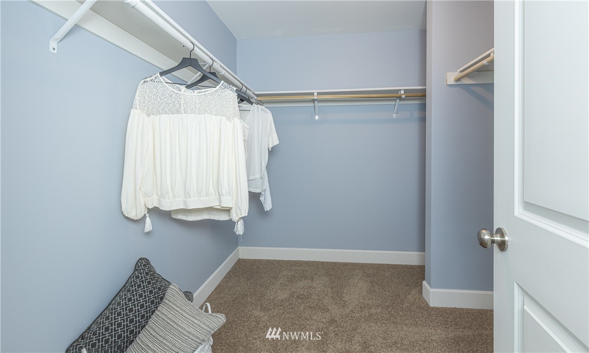 613 Index Avenue Northeast Renton, WA 98056 - Photo 22 of 32 a view of walk in closet with clothes and shoes