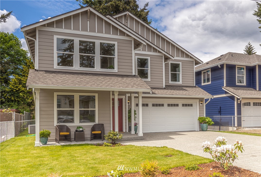 613 Index Avenue Northeast Renton, WA 98056 - Photo 32 of 32 a front view of a house with a yard
