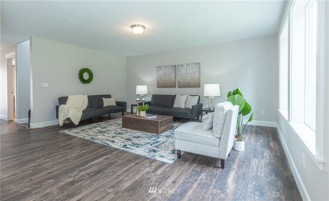 613 Index Avenue Northeast Renton, WA 98056 - Photo 5 of 32 a living room with furniture and wooden floor