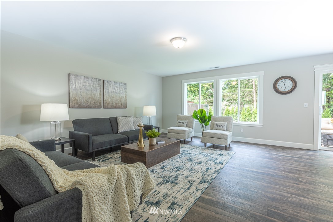 613 Index Avenue Northeast Renton, WA 98056 - Photo 6 of 32 a living room with furniture and a window