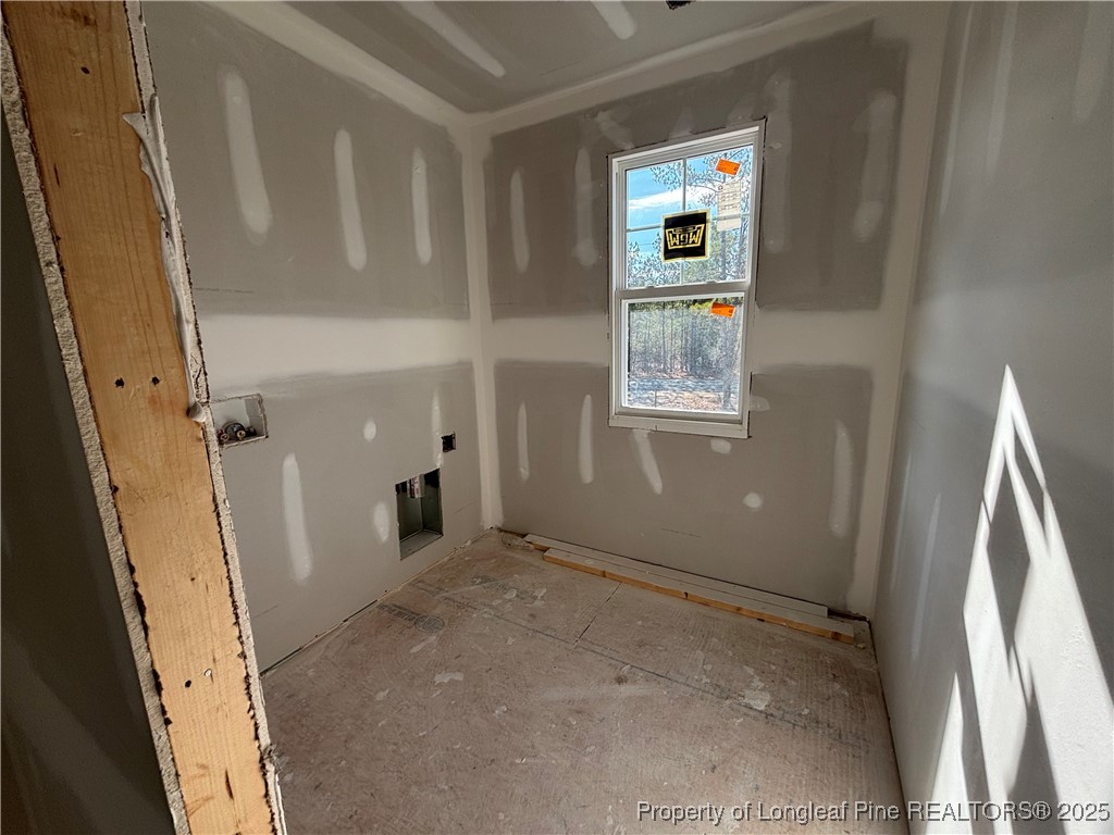 2918 Calloway Road Raeford, NC 28376 - Photo 12 of 13 a view of a hallway with wooden floor and windows