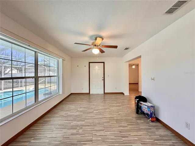 a view of livingroom with hardwood floor and a ceiling fan