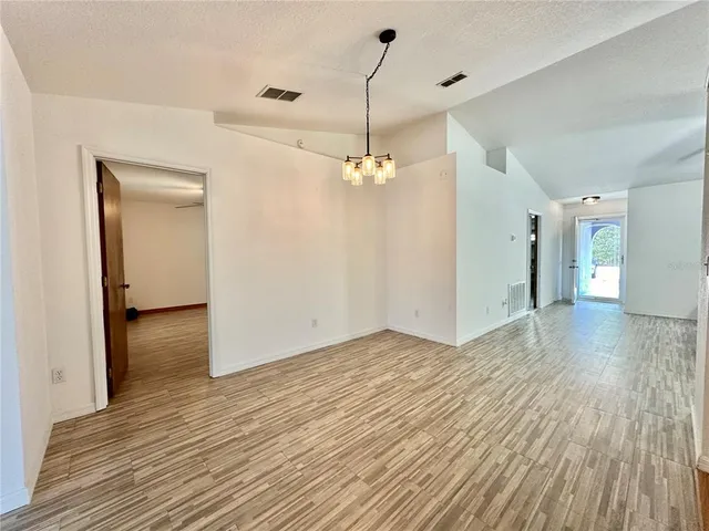 a view of a livingroom with wooden floor