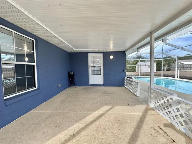 a view of a livingroom with wooden floor and windows
