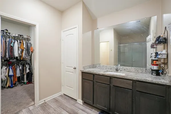a en suite bathroom with a sink and a mirror