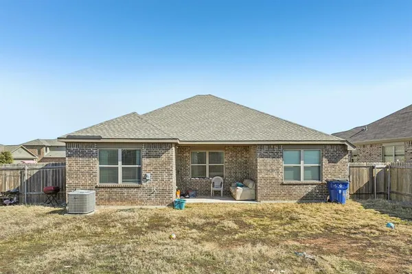 a house with yard in front of it