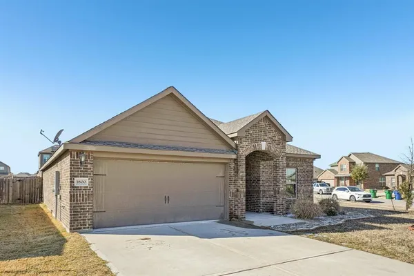 a front view of a house with a garage