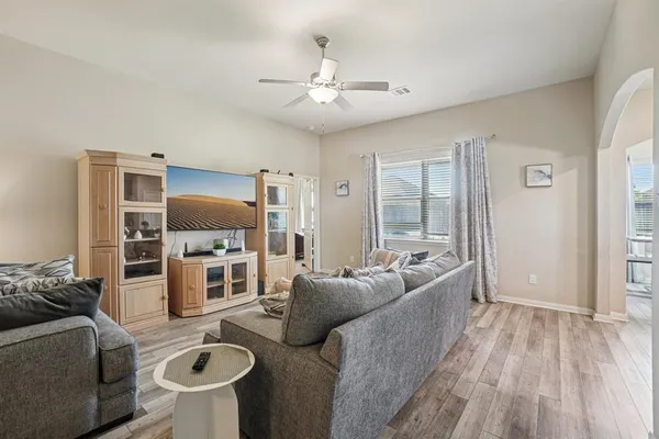 a living room with furniture and a flat screen tv
