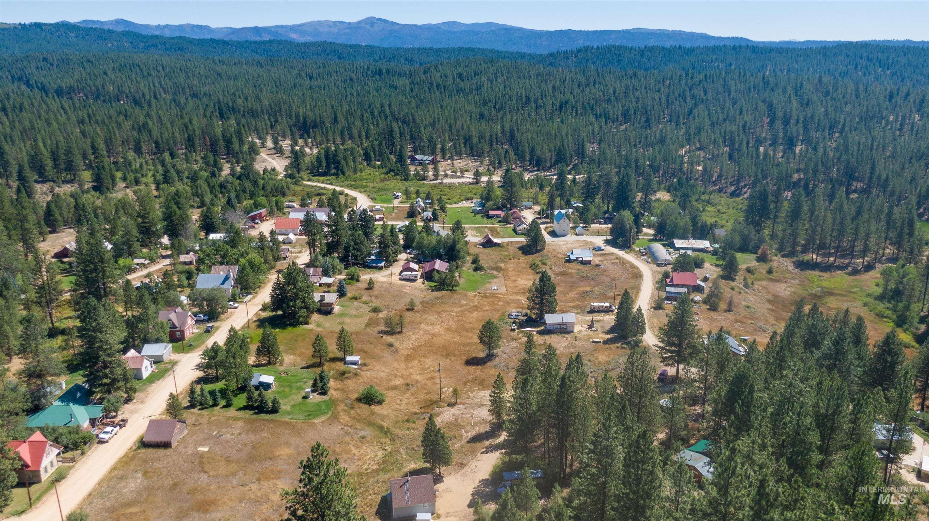 175 Ranft Road Placerville, ID 83666 - Photo 27 of 28 Aerial view of property's location featuring a forest and mountains