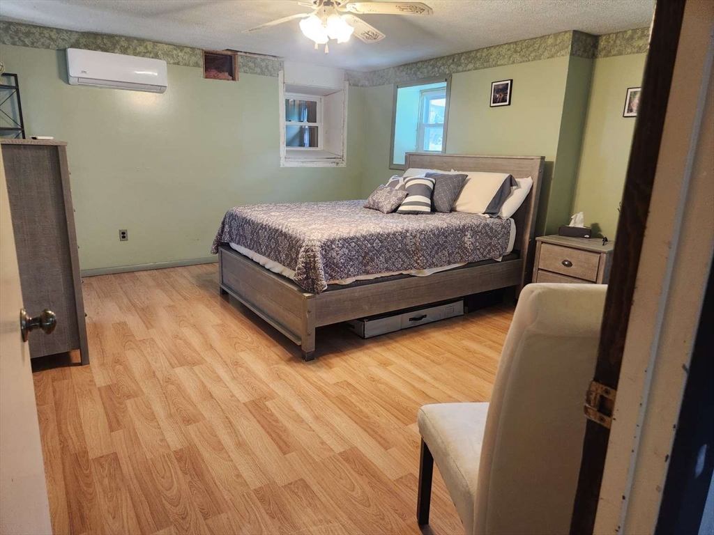 153 Off Pond Street Dunstable, MA 01827 - Photo 15 of 19 a bedroom with a bed and a dresser in it