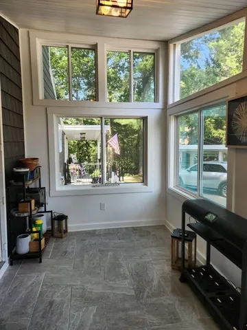 a view of livingroom with furniture and a window