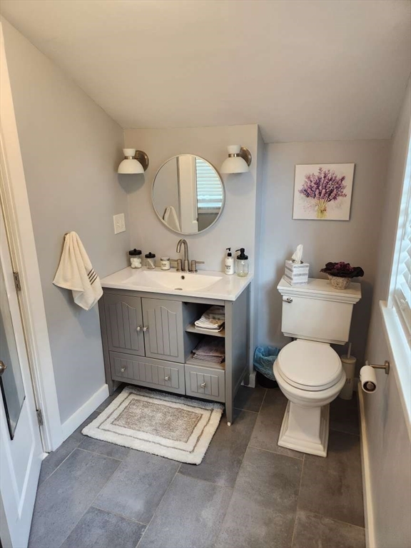 153 Off Pond Street Dunstable, MA 01827 - Photo 10 of 19 a bathroom with a toilet sink and mirror