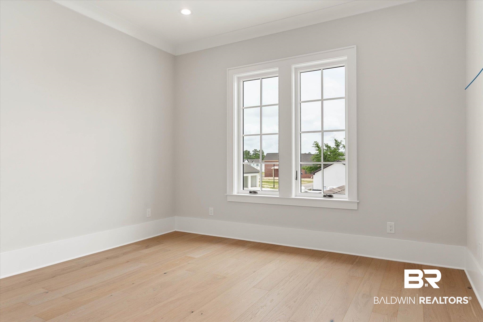 853 Inlet Circle Gulf Shores, AL 36542 - Photo 31 of 55 Empty room with baseboards, recessed lighting, light wood-style flooring, and ornamental molding