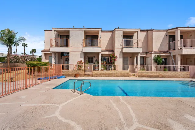 a view of a building with a swimming pool