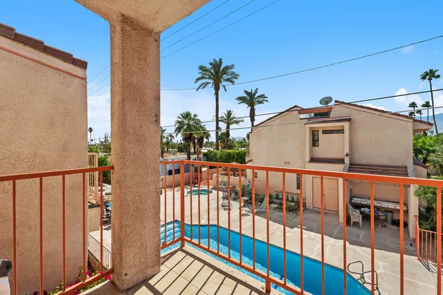 a view of balcony with furniture