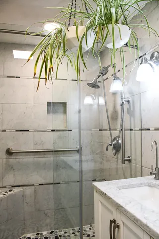 a bathroom with a sink and mirror