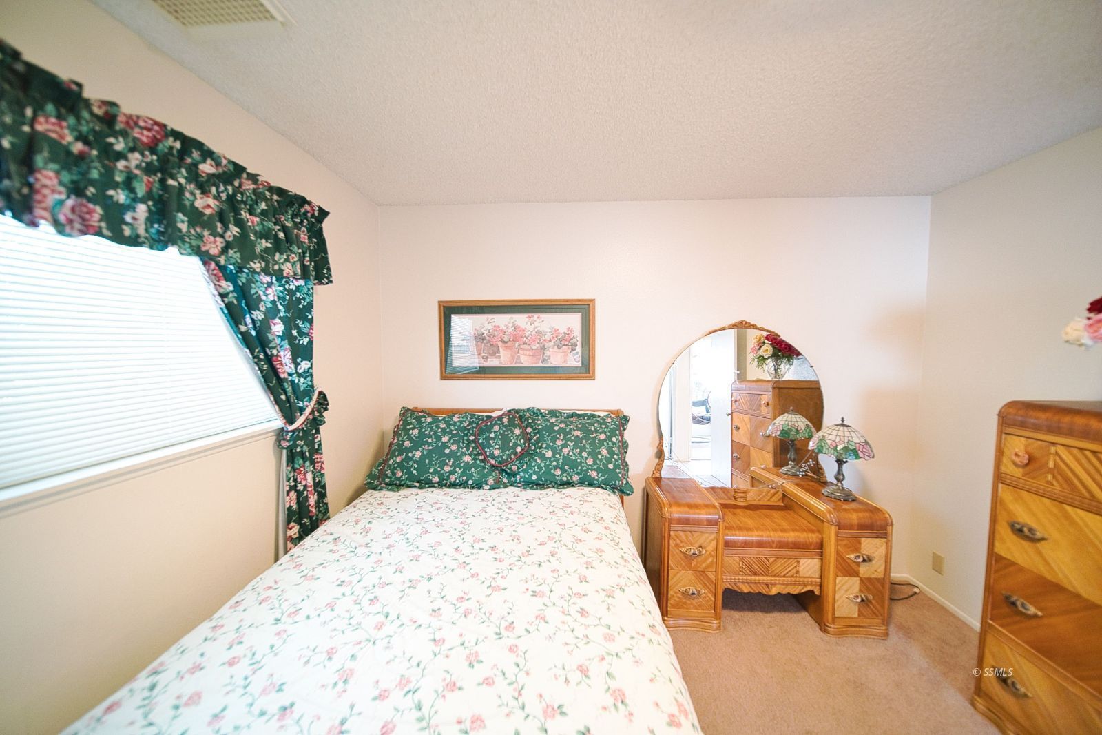 1024 Sherri Street Ridgecrest, CA 93555 - Photo 23 of 41 a view of a bedroom with a bed and wooden floor