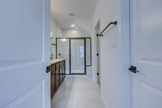 a bathroom with a sink vanity and a mirror