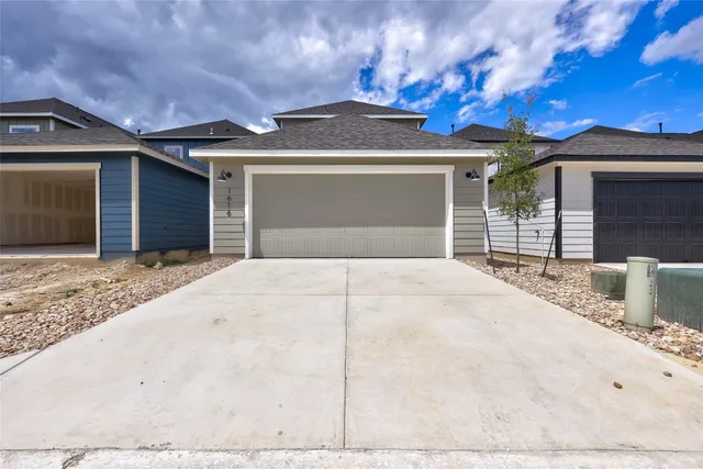 a front view of a house with a garage