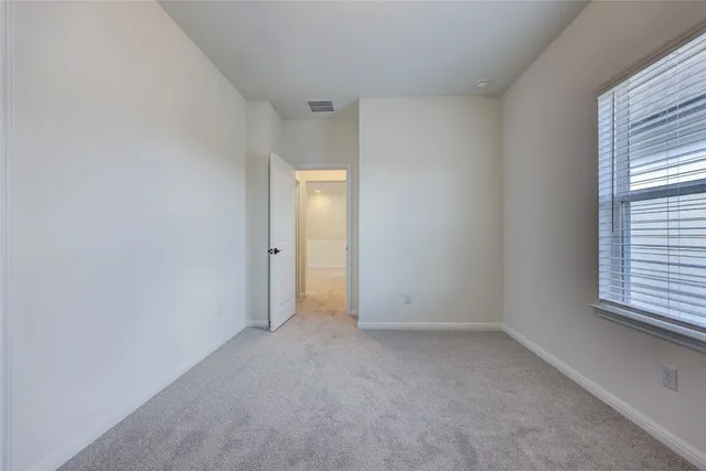 a bathroom with a bathtub and toilet