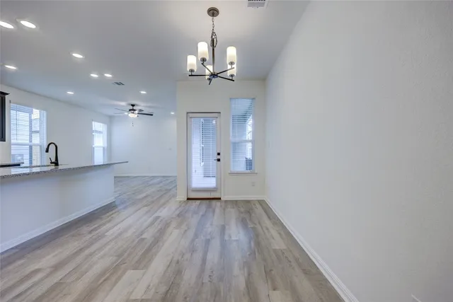 a view of a kitchen with a sink and a fireplace