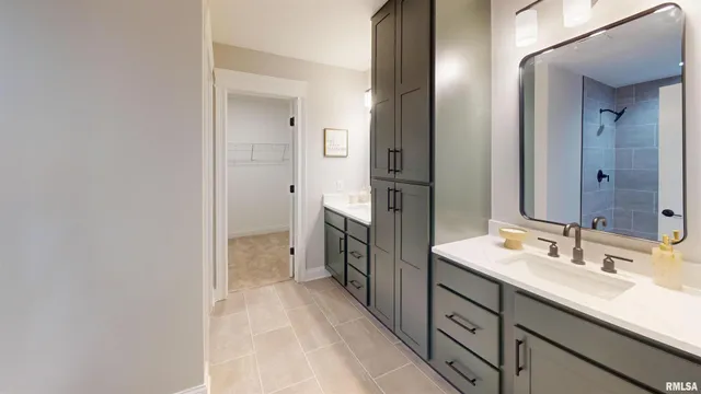 a spacious bathroom with a double vanity sink a mirror and a shower