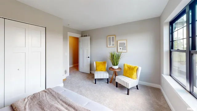 a bedroom with a bed and a couch