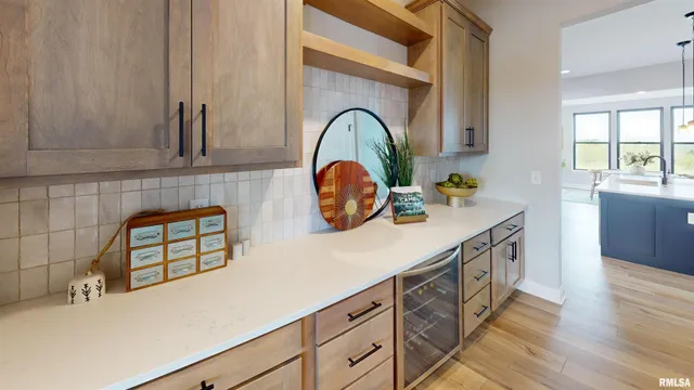 a kitchen with a sink cabinets and a wooden floor