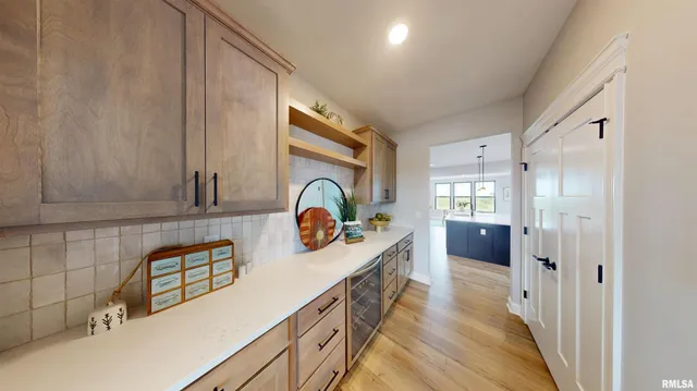 a kitchen with sink a stove and cabinets