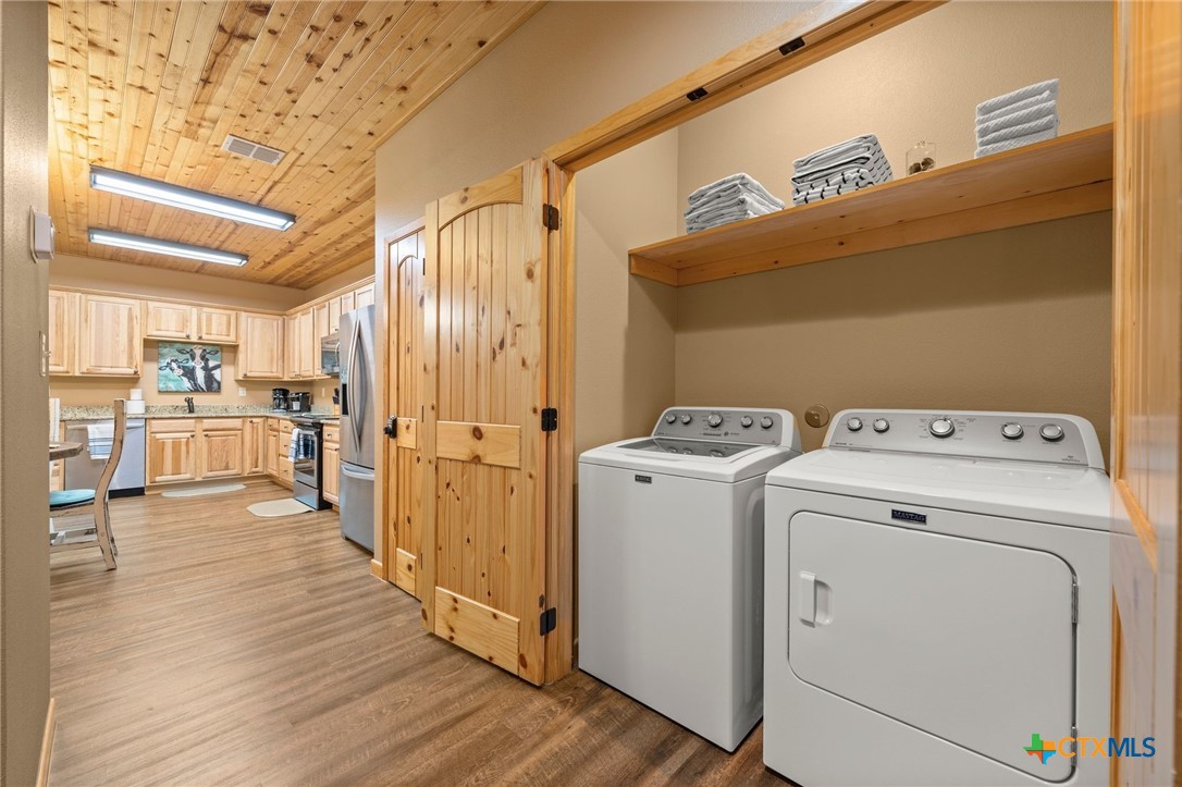 1554 Gruene Road, Unit A10 New Braunfels, TX 78130 - Photo 13 of 32 a view of a storage & utility room with washer and dryer