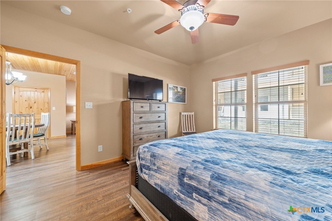 1554 Gruene Road, Unit A10 New Braunfels, TX 78130 - Photo 20 of 32 a bedroom with a bed and a flat screen tv