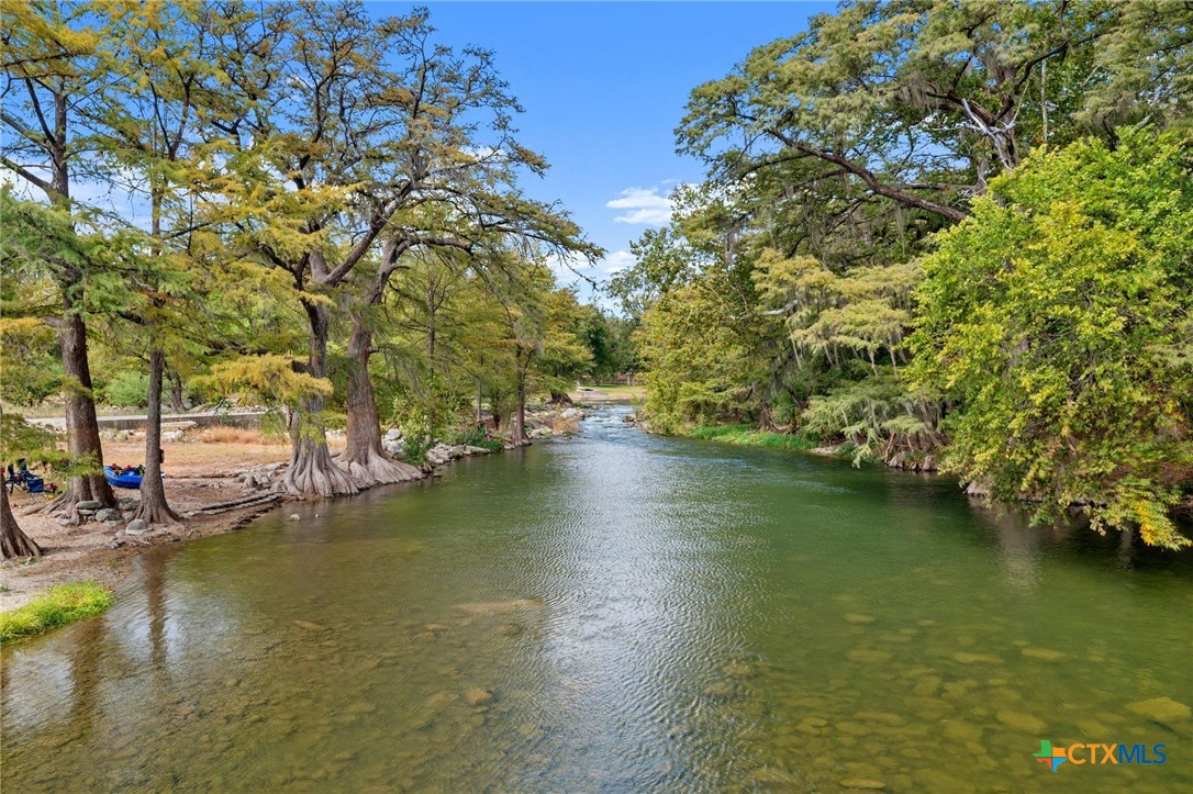 1554 Gruene Road, Unit A10 New Braunfels, TX 78130 - Photo 27 of 32 a view of a lake with houses